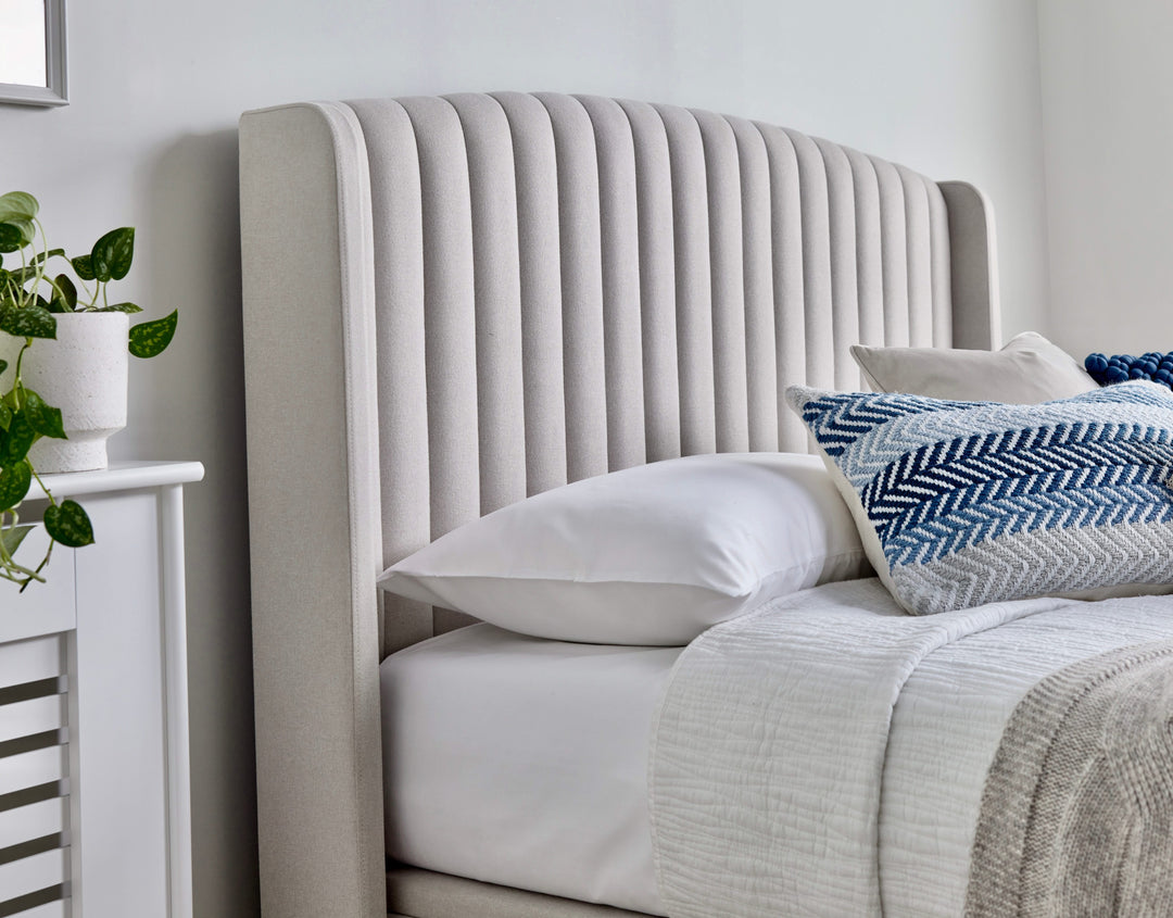 Essence Ottoman Storage TV Bed with USB Charging in Natural Cream Fabric.