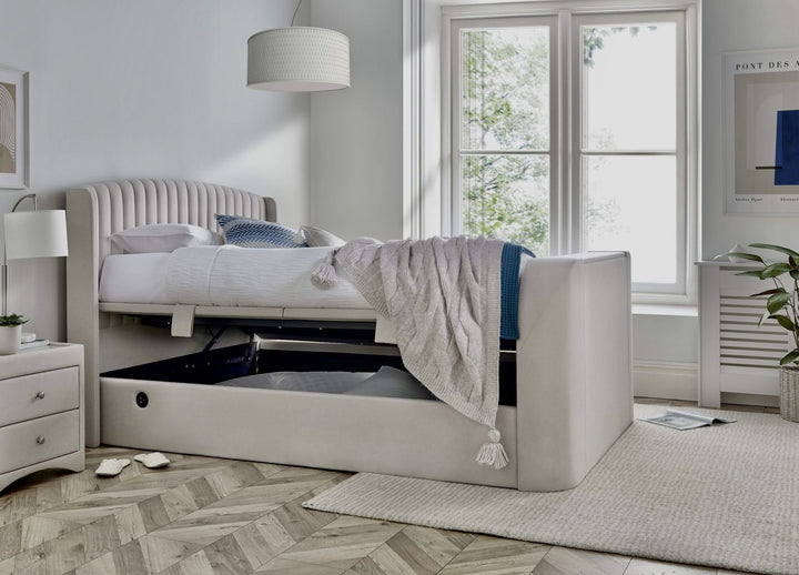 Essence Ottoman Storage TV Bed with USB Charging in Natural Cream Fabric.