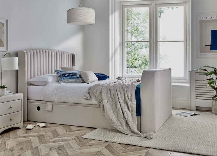 Essence Ottoman Storage TV Bed with USB Charging in Natural Cream Fabric.